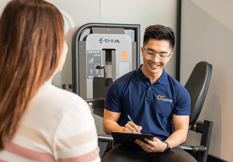 Workplace rehabilitation consultant helping an injured worker during a medical case conference